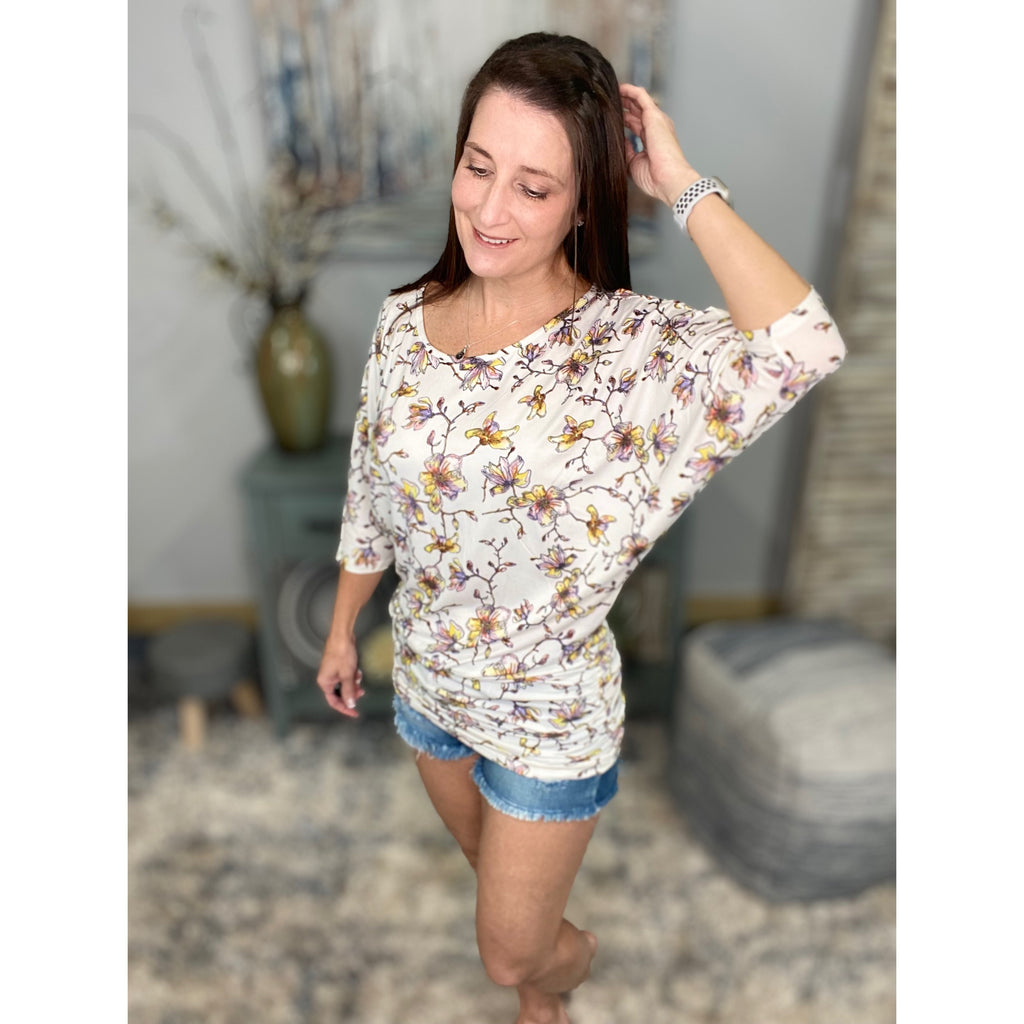 “Everybody Talks” Floral Tunic Dolman Sleeve Scoop Neck Hip Hugging Ruching Detail Top Cream